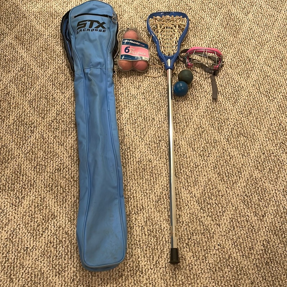 Lacrosse stick, mask, and balls